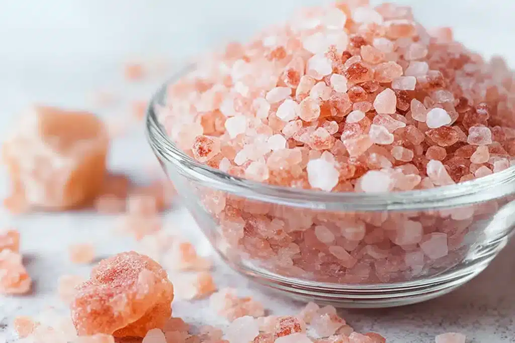 Himalayan Pink Salt Side Effects: What Happens When You Overdo It 3 himalayan pink salt side effects crystals in glass bowl
